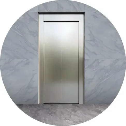 a stainless steel door in a marble wall