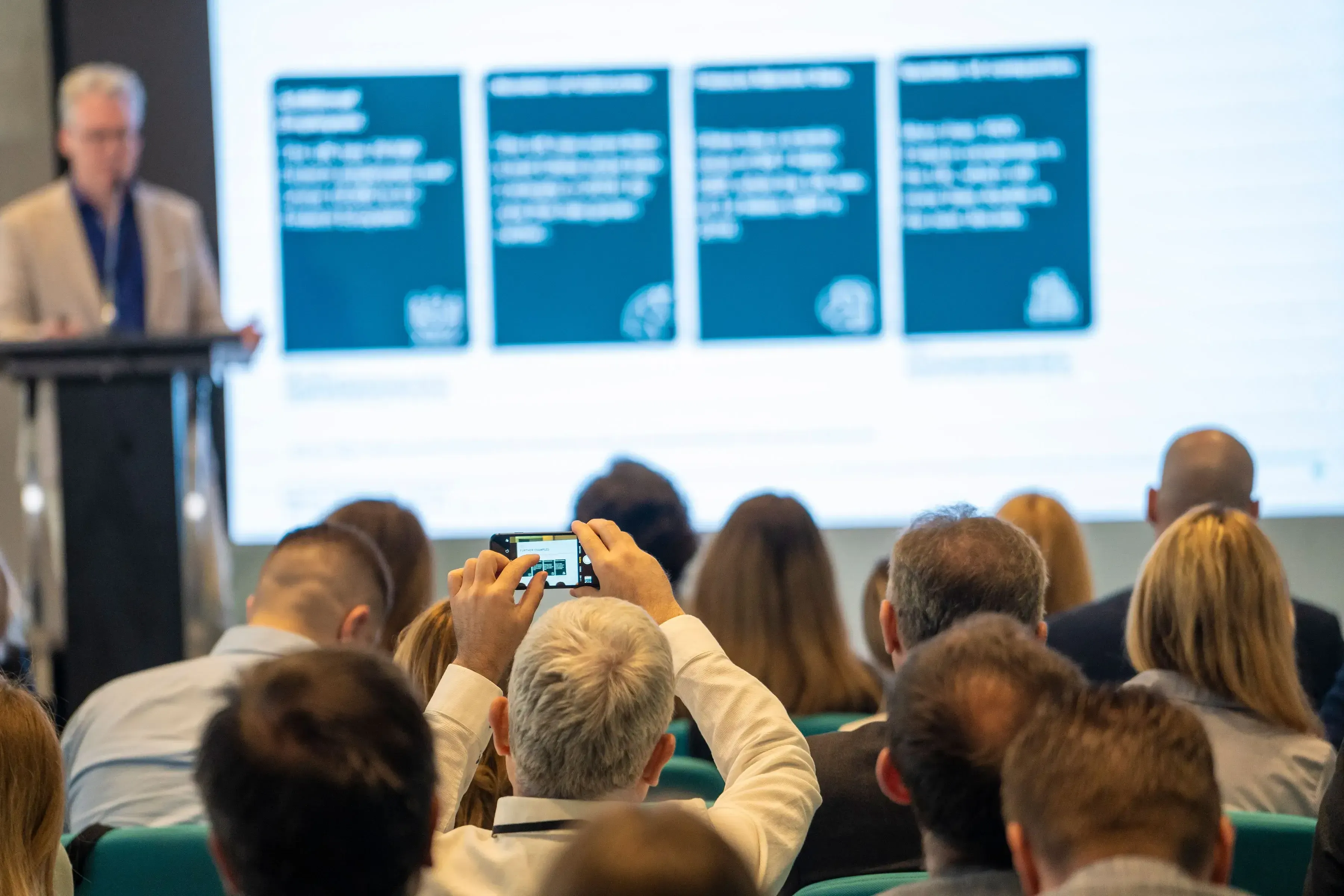 A man giving a presentation to a group of people