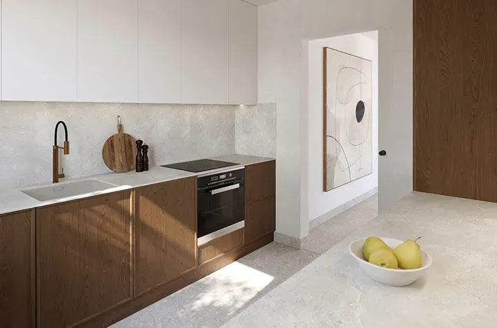 a bowl of fruit sitting on a counter in a kitchen