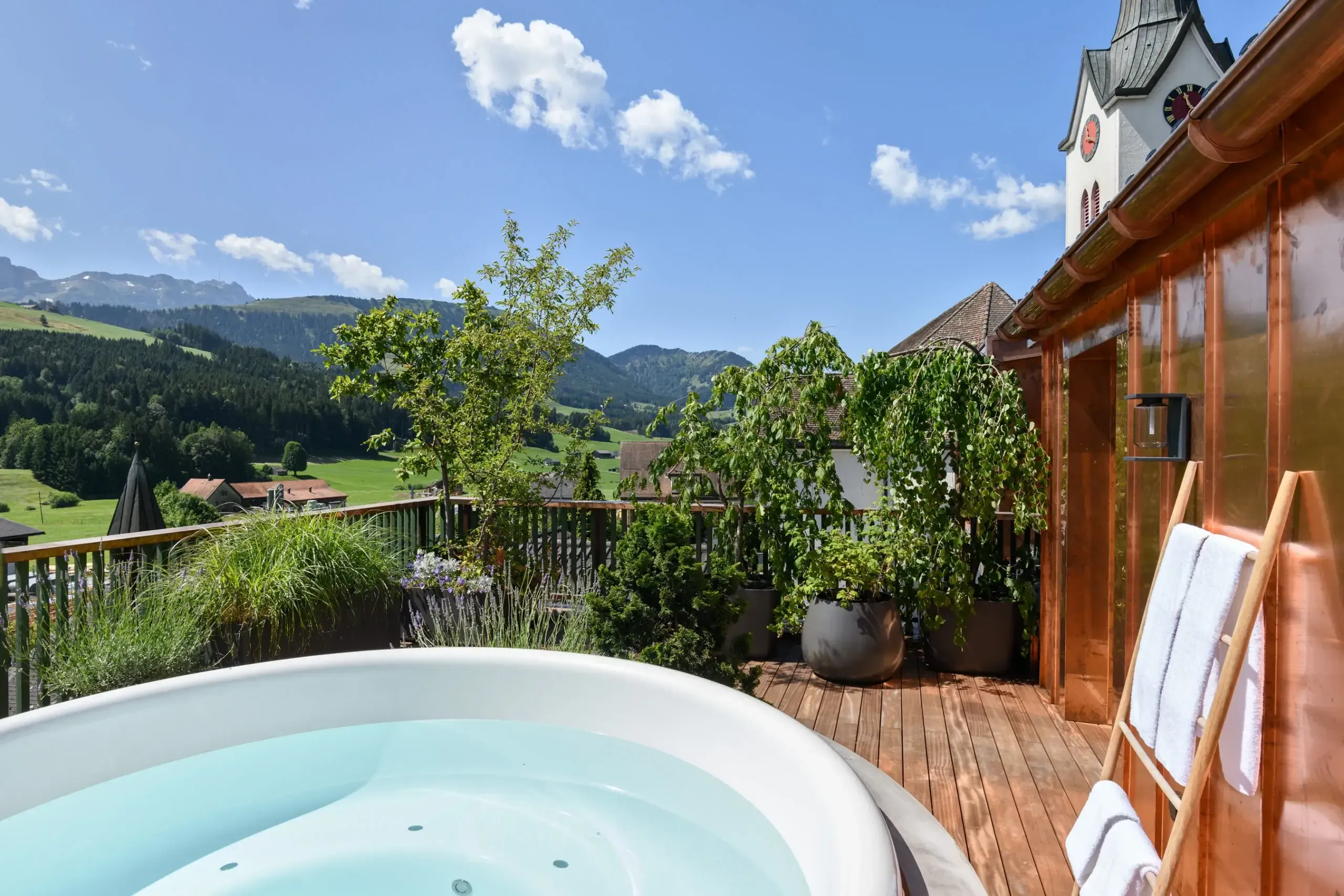 A hot tub sitting on top of a wooden deck