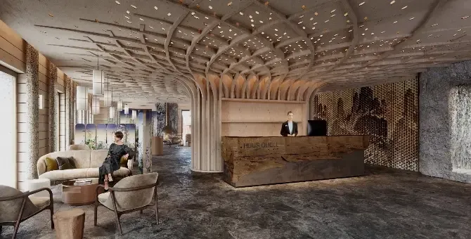 The lobby of a hotel with a wooden ceiling